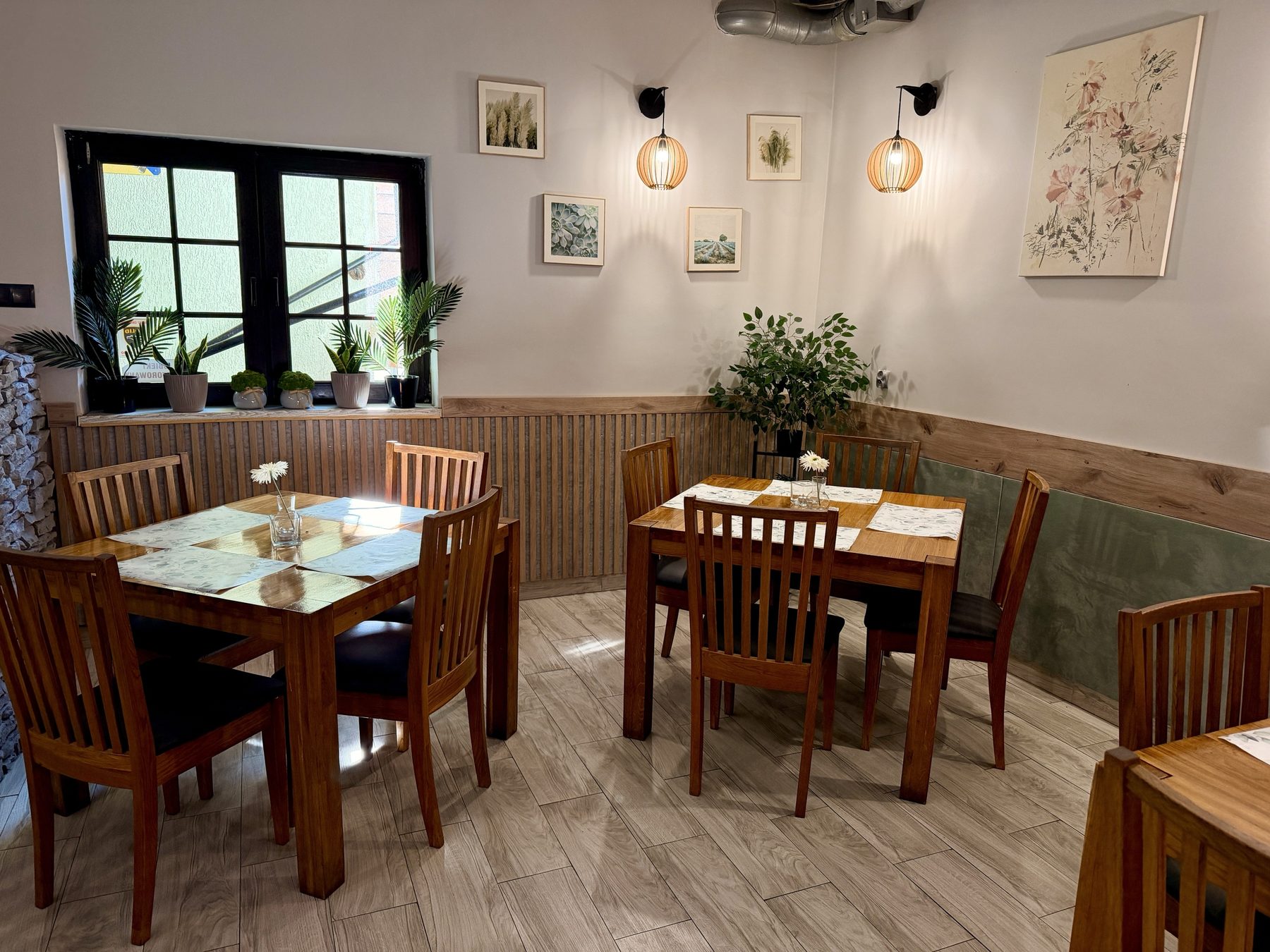 Tables by the window in the Soprano dining room